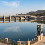 A20clean20professional20cinematic20wide20shot20of20the20pristine20water20behind20the20gaya20ji20rubber20dam20with20clear20walkways20under20natural20lighting